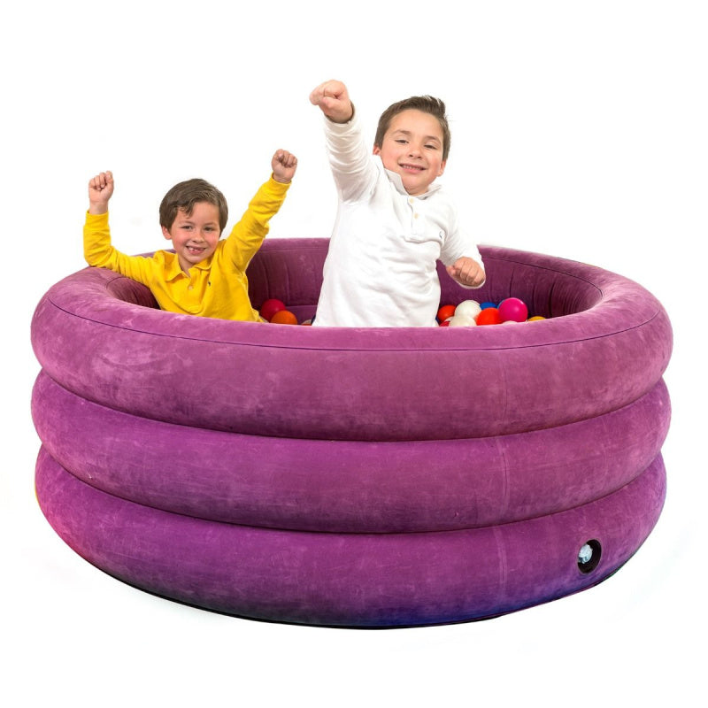 children playing in purple airlite ball pit 