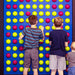 kids interacting with litezilla spinfinity wall