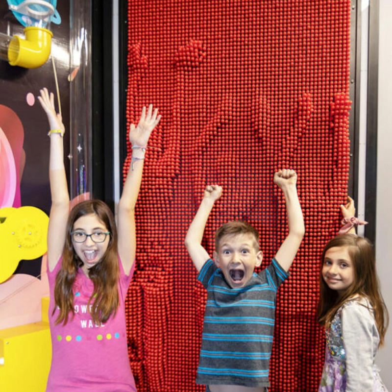 chlidren playing with litezilla clonebox pin wall