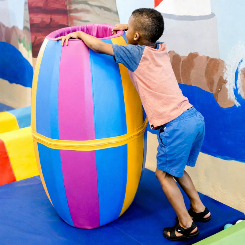 child playing with sensasoft play barrel