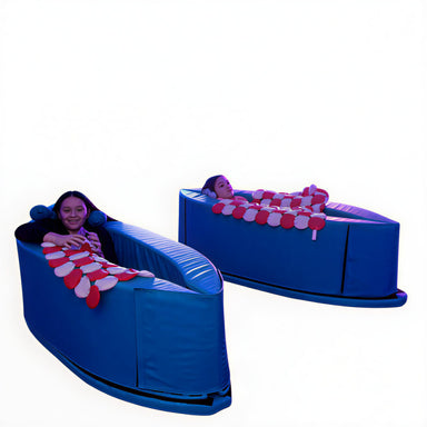 kids relaxing in sensasoft deep pressure therapy compression canoe