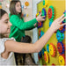 kid playing with magnet wall
