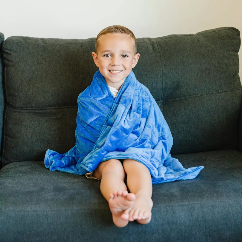 kid using soft plush weighted blanket